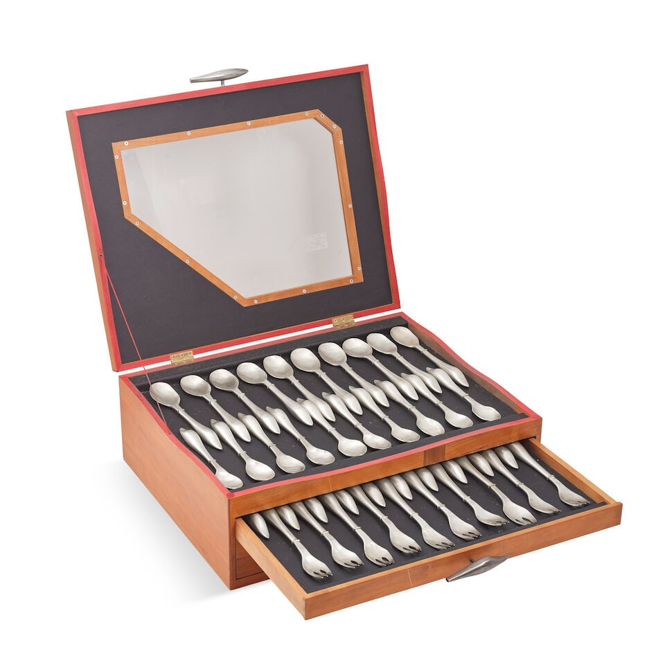 A modern design silver table service of flatware and cutlery in a bespoke designed wood canteen...: A modern design silver table service of flatware and cutlery in a bespoke designed wood canteen box Patricia Jean Hamilton, London 1991, canteen by Nickolas Pryke Furniture With filled shaped handles 