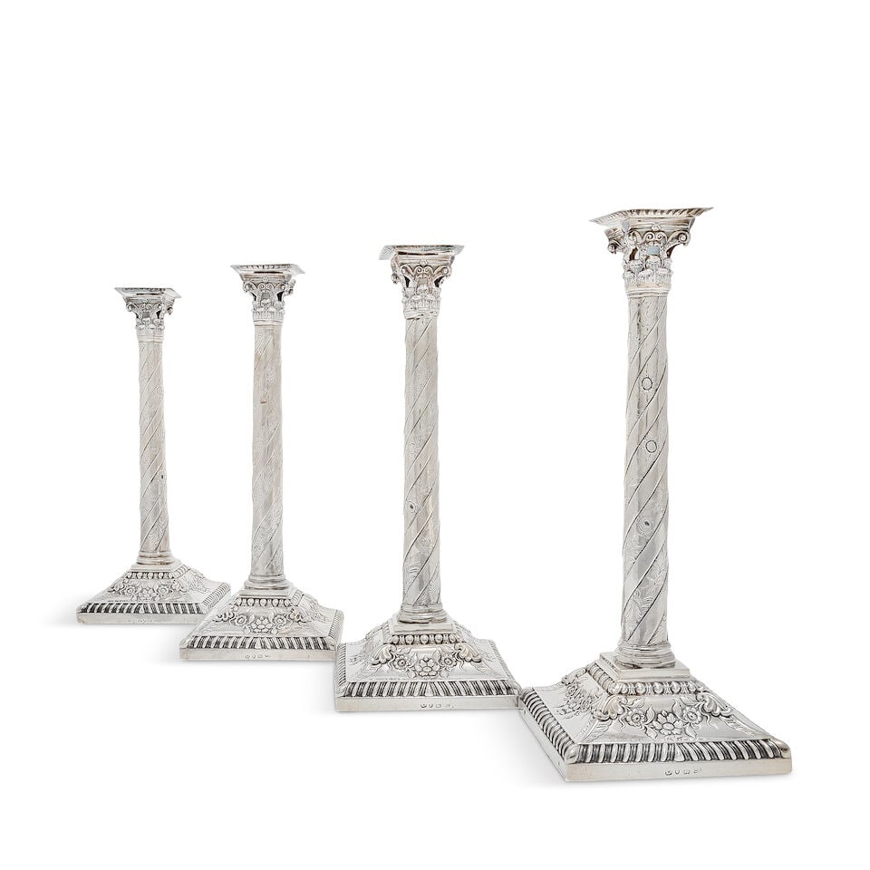 A set of four George II silver Corinthian column candlesticks unidentified maker's mark of JL be... (1 of 2)