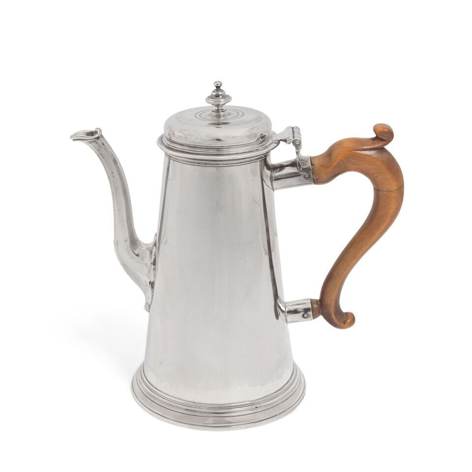 A George II silver coffee pot James Smith I, London 1735: A George II silver coffee pot James Smith I, London 1735 Plain tapering form, hinged domed cover and baluster finial on circular moulded rim foot with curved faceted spout, height 21.2cm, weight total