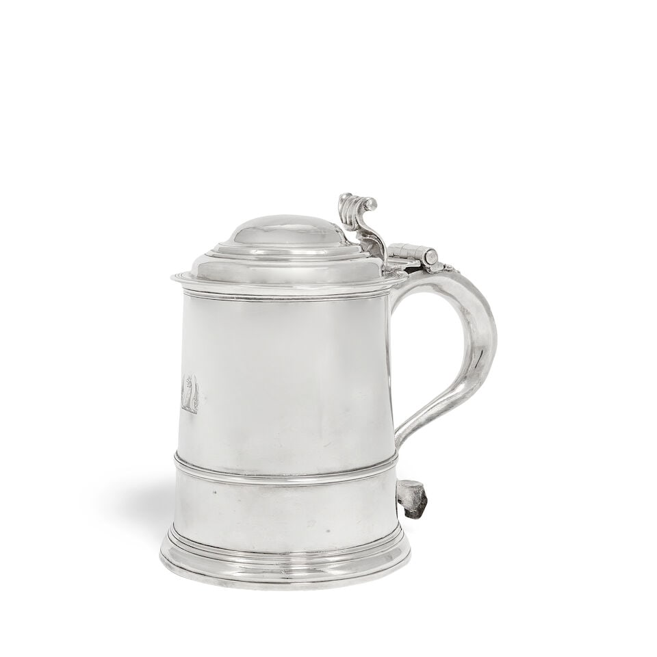 A George I Britannia standard silver tankard Timothy Ley, London 1717: A George I Britannia standard silver tankard Timothy Ley, London 1717 Straight sided slightly tapering form, with lightly domed hinged cover with scrolling thumbpiece, with applied girdle, engraved wi