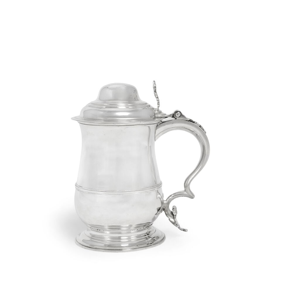 An early George III silver tankard William Shaw II & William Priest, London 1760: An early George III silver tankard William Shaw II & William Priest, London 1760 Baluster form with applied girdle, hinged dome cover with open-work scrolling thumbpiece, handle with scrolling termina