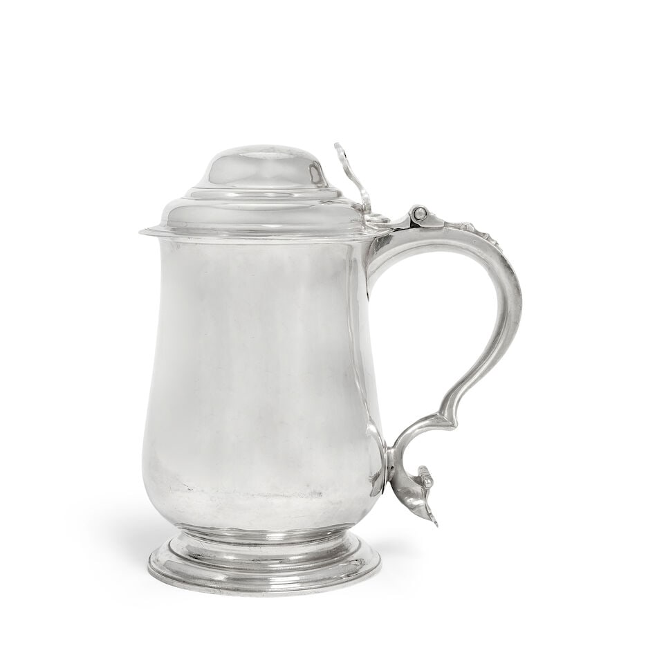 A George III silver tankard Thomas Whipham & Charles Wright, London 1764: A George III silver tankard Thomas Whipham & Charles Wright, London 1764 Baluster form, with domed cover with open work scroll thumbpiece, with scroll handle, with scrolling shield terminal, height 20