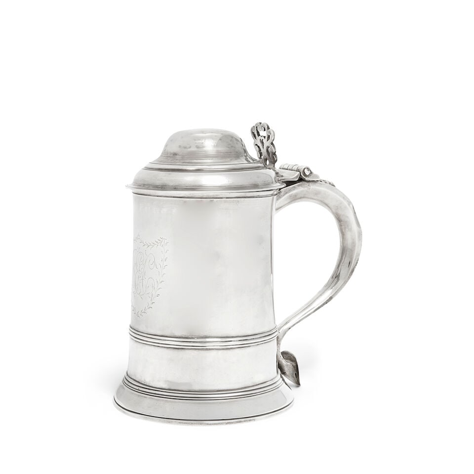 A George III silver tankard probably John King London 1783: A George III silver tankard probably John King London 1783 Slightly tapering straight sided form, with domed cover with openwork scrolling thumbpiece, with scroll handle engraved with initials T.S, wi