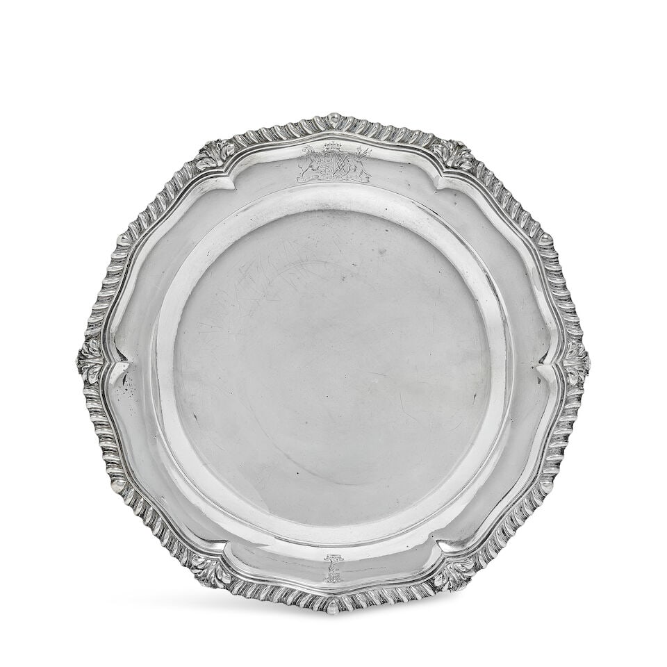 A William IV silver plate makers marks WE, London 1833: A William IV silver plate makers marks WE, London 1833 Shaped-circular form, with gadrooned and acanthus leaf rim, the border engraved with the arms of CADOGAN., diameter 25cm, weight 19oz. Footnotes: