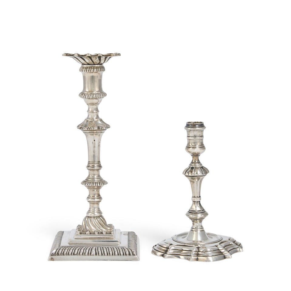 A George II cast silver taperstick James Gould, London 1740 together with a George III cast silv...: A George II cast silver taperstick James Gould, London 1740 Spool shaped nozzle, with faceted knopped baluster form stem, on a shaped-circular base, with engraved crest on base, height 10.8cm; togethe