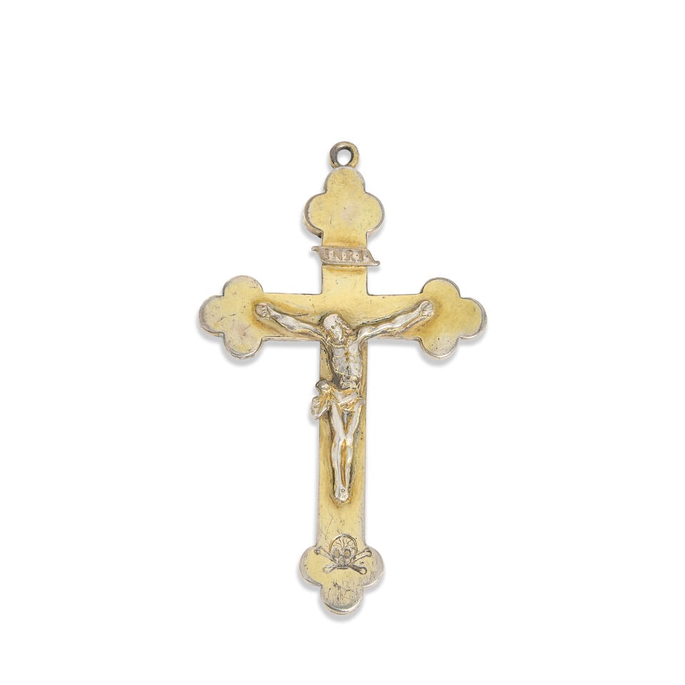 A silver-gilt and wood mounted crucifix pendant apparently unmarked, late 17th century: A silver-gilt and wood mounted crucifix pendant apparently unmarked, late 17th century Of typical form, with Christ to the centre, below scroll 'I.N.R.I', above an engraved memento mori, the reverse m