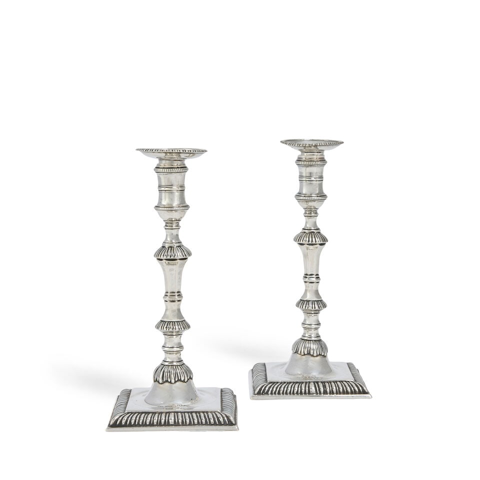 A pair of George III silver tapersticks William Cafe, London 1763: A pair of George III silver tapersticks William Cafe, London 1763 Detachable circular beaded drip pans, on fluted knopped stem, to a sunken square gadrooned base, height 15.7cm, weight 13oz. Footnotes