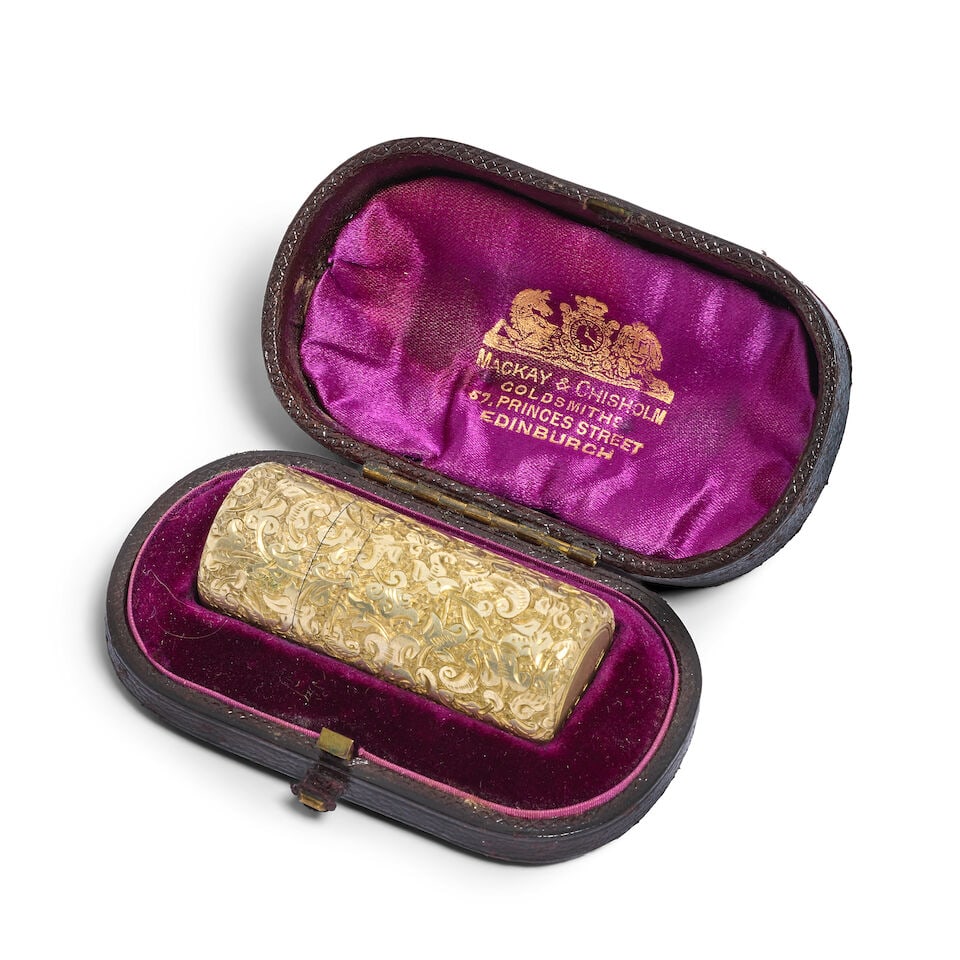A Victorian silver-gilt scent bottle Sampson Mordan & Co, London 1881: A Victorian silver-gilt scent bottle Sampson Mordan & Co, London 1881 Cylindrical form, the whole with foliate scrolling chasing throughout, with engraved initials to the cover, held in fitted case, l