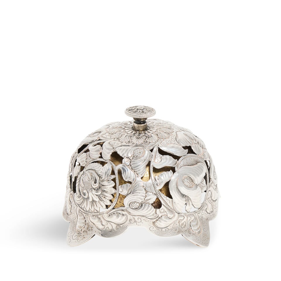 A Victorian silver table bell Samuel Walton Smith, Birmingham 1888: A Victorian silver table bell Samuel Walton Smith, Birmingham 1888 Domed form with pierced and embossed foliate design with circular twist bell mechanism, raised on four tapering feet, height 6cm. For