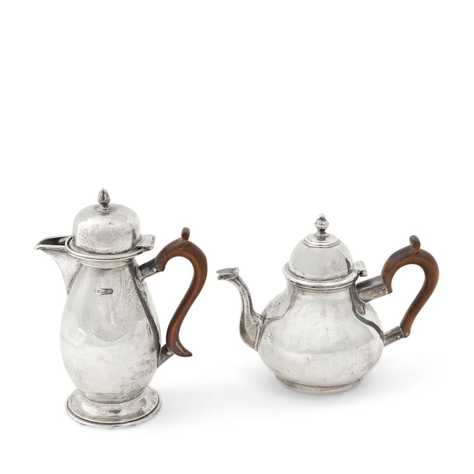 A silver small tea pot Charles Stuart Harris, London 1898 together with another Victorian silver...: A silver small tea pot Charles Stuart Harris, London 1898 In the 18th century style, plain pear form, hinged dome cover, wood handle, length 18cm; together with another Victorian silver small silver p