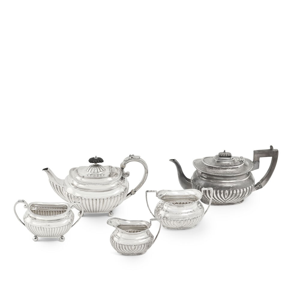 A Victorian silver three-piece bachelors' tea service, together with a Victorian silver bachelor... (1 of 2)