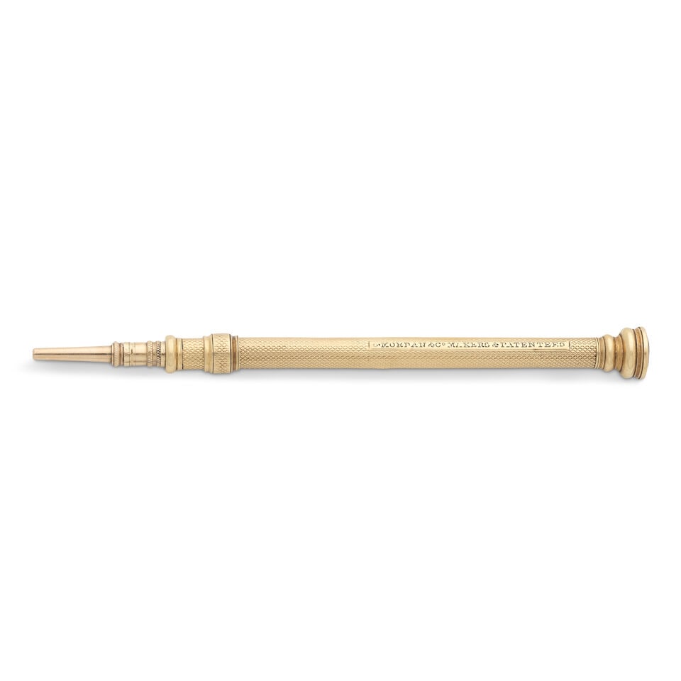 A yellow metal and gem set propelling pencil stamped 'S.MORDAN & CO MAKERS AND PATENTERS': A yellow metal and gem set propelling pencil stamped 'S.MORDAN & CO MAKERS AND PATENTERS' Typical form, with engine turned decoration, set with a faceted amethyst, length 10.5cm. For further