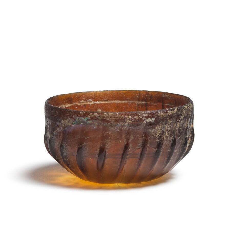 A Roman pillar-moulded amber glass bowl - 2