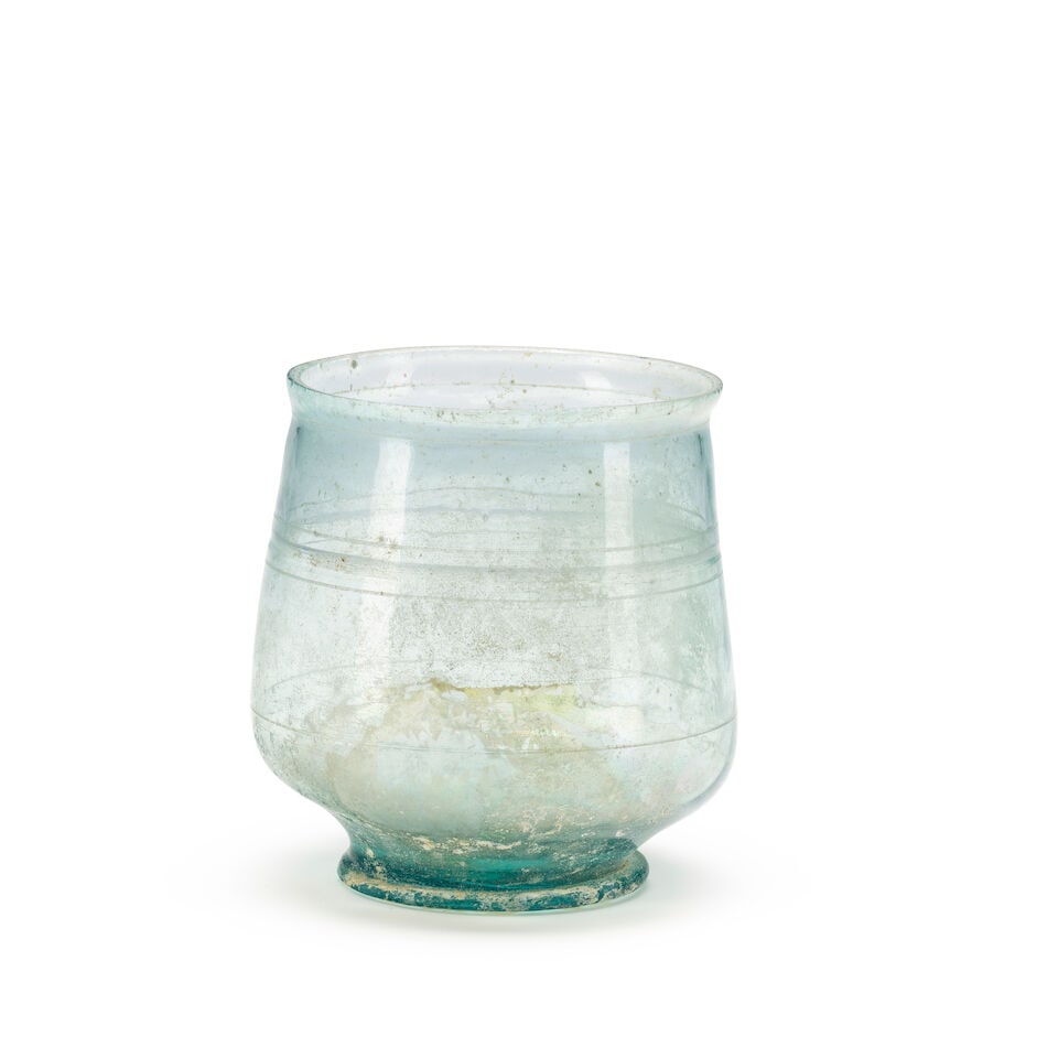 A Roman pale blue glass beaker on a pad base - 2