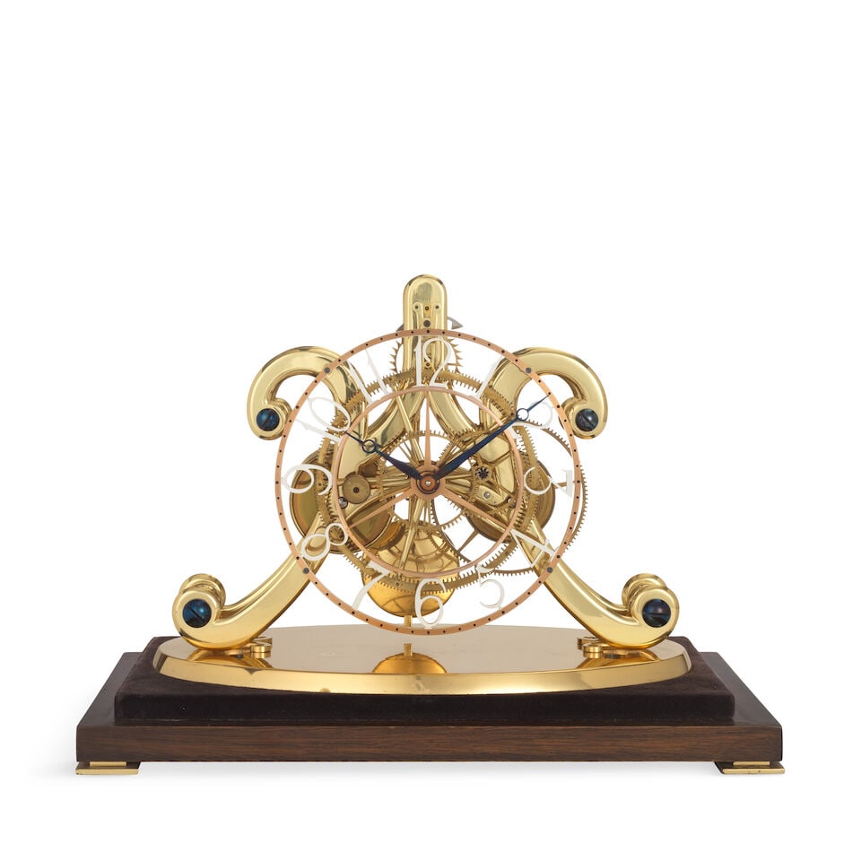 A good 20th century skeleton clock with epicyclic gearing Fred Whitlock: A good 20th century skeleton clock with epicyclic gearing Fred Whitlock The skeletonised dial with white Arabic numerals for the hours, black minute markers and steel hands. The single fusee movement