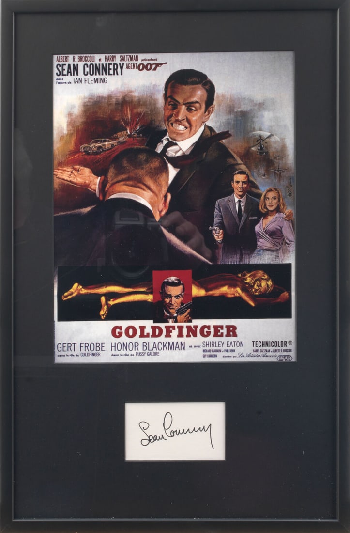 A Sean Connery signature 'Goldfinger' display,: A Sean Connery signature 'Goldfinger' display, comprising the signature in black marker on paper, common mounted with miniature reproduction of Goldfinger movie poster, 31 x 24cm., framed and glazed.