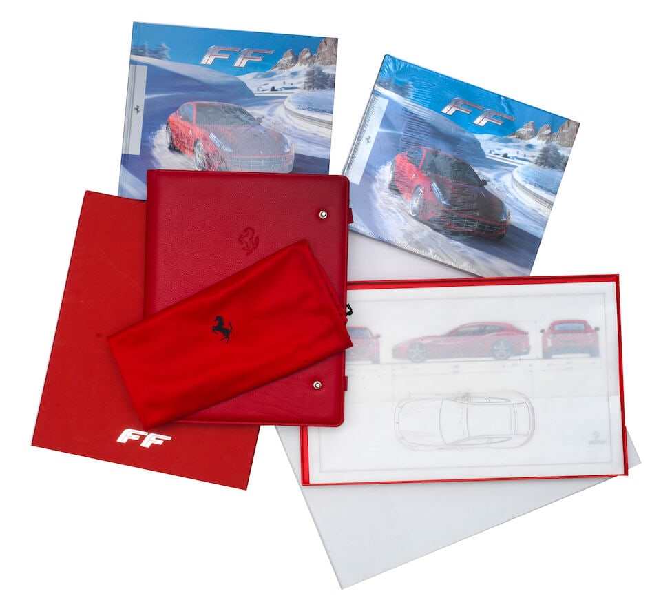 A boxed Ferrari FF 'Welcome to Ferrari' leather document organiser by Poltrona Frau of Italy, ci...: A boxed Ferrari FF 'Welcome to Ferrari' leather document organiser by Poltrona Frau of Italy, circa 2011, Rosso Pelle Frau leather ring-bound A4 file folder, containing 'Welcome to Ferrari' promotiona