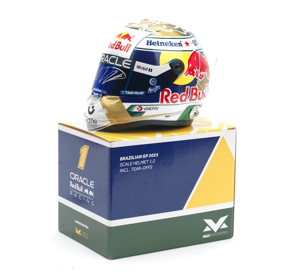 An official signed Max Verstappen Brazilian GP 2025 1/2 scale helmet,: An official signed Max Verstappen Brazilian GP 2025 1/2 scale helmet, signed to the visor in silver, comes with a pack of spare tear-off's, cloth helmet bag and original box. For further information