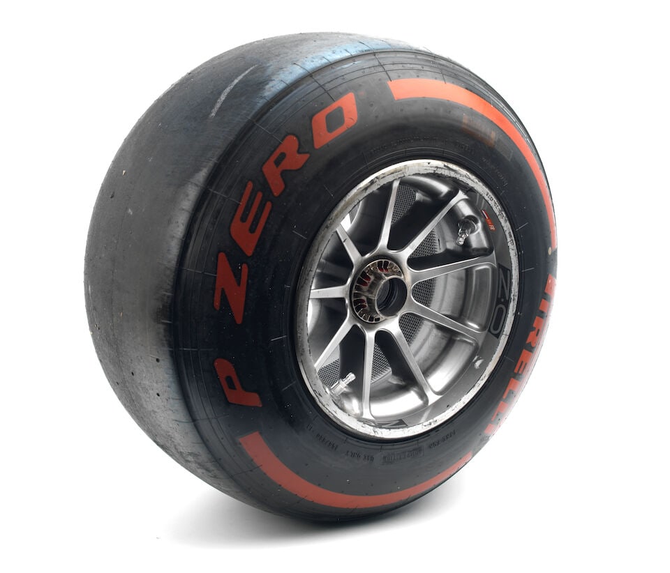 A Red Bull Racing RB16 front left wheel with Pirelli tyre, from Max Verstappen's car,: A Red Bull Racing RB16 front left wheel with Pirelli tyre, from Max Verstappen's car, silver alloy by OZ wheels, with sticker on inside with Dutch flag, FL and No.33, numbered to the rim 220 20 #276,