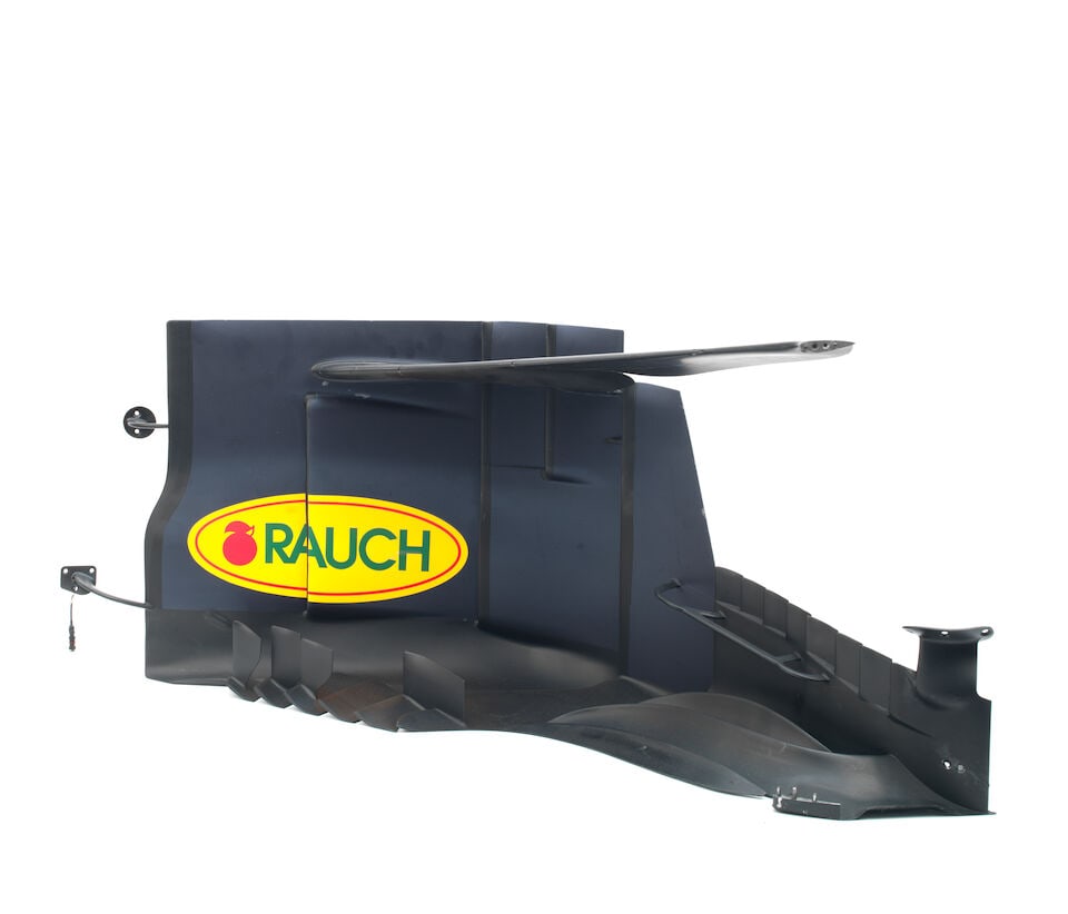 A 2018 Red Bull RB14 Barge Board section,: A 2018 Red Bull RB14 Barge Board section, carbon fibre, in blue and red, signs of wear, numbered RB14-BO-00965-05#105 to underside, approximately 110cm long. For further information on this lot