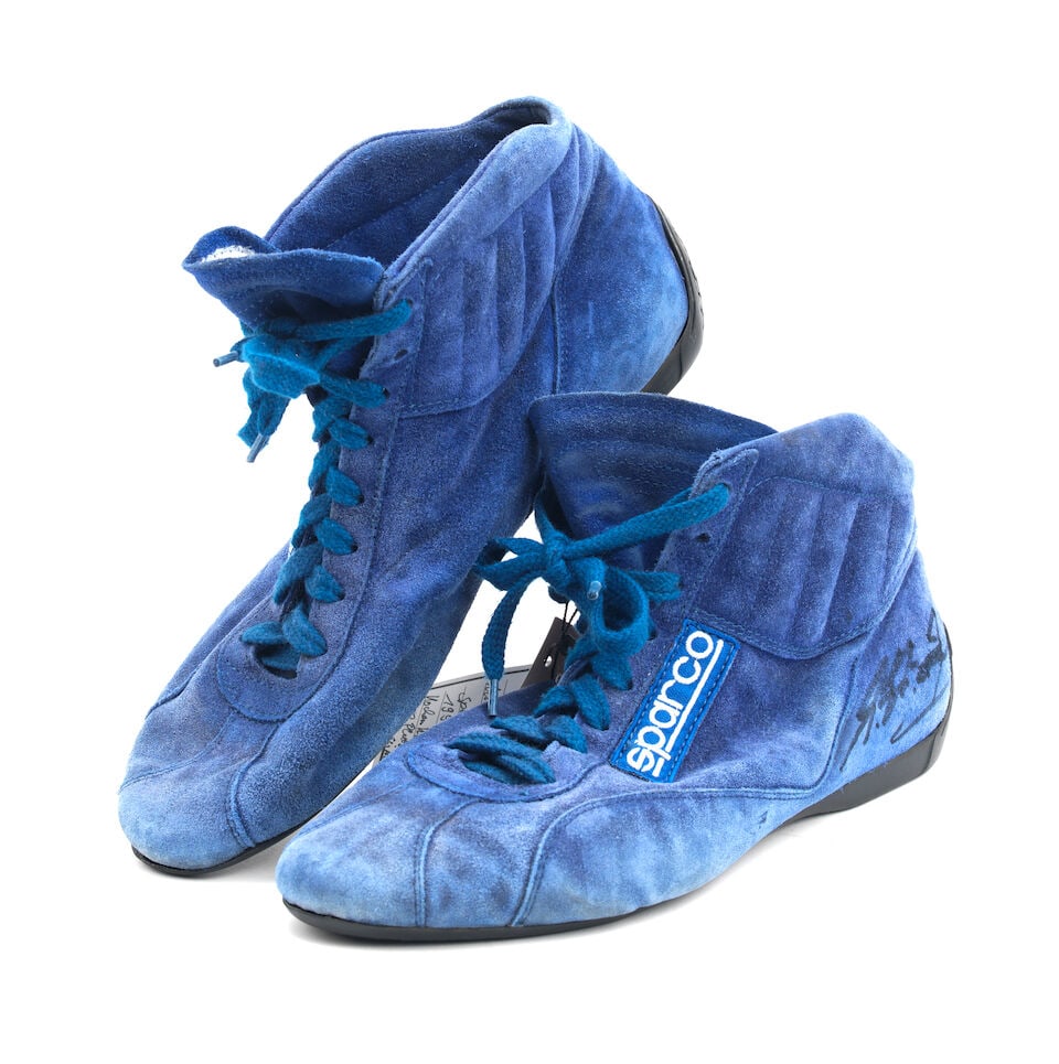 A signed pair of 1993 Michael Schumacher Sparco racing boots,: A signed pair of 1993 Michael Schumacher Sparco racing boots, in blue with wear and tear from use, signed on both boots in black marker, the inside of each tongue with MS 93 written alongside the