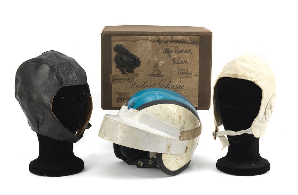 A 1960s Kangol helmet, formerly the property of Consalvo Sanesi, ((4)): A 1960s Kangol helmet, formerly the property of Consalvo Sanesi, in blue, white and black design, with white peak, offered together with a Herbert Johnson box addressed to Doctor Sanesi, Alfa Romeo,