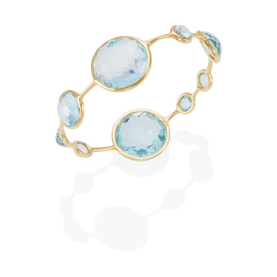 IPPOLITA: 18K GOLD AND TOPAZ BANGLE BRACELET: IPPOLITA: 18K GOLD AND TOPAZ BANGLE BRACELET • 18k yellow gold • Numerous round faceted topaz cabochons measuring approximately 7.18 - 20.98 mm • Signed IPPOLITA, partially worn R