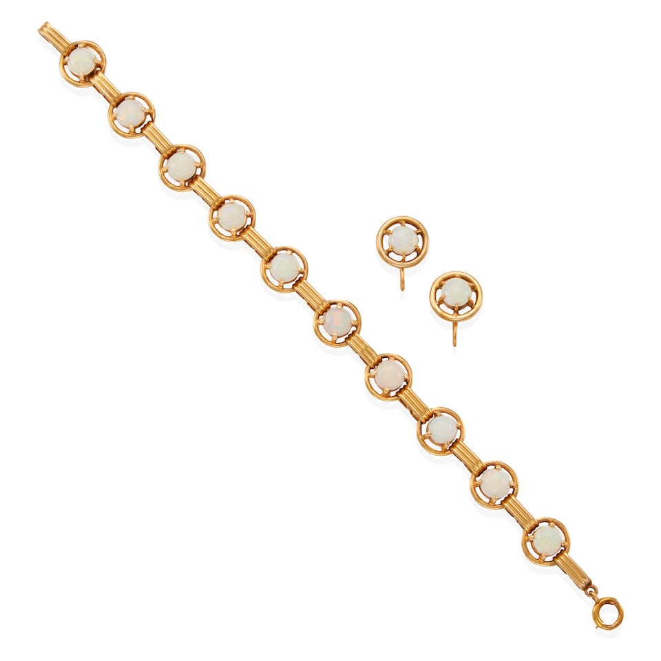 14K GOLD AND OPAL BRACELET AND EARRING SET: 14K GOLD AND OPAL BRACELET AND EARRING SET •14k yellow gold bracelet with 10 round cabochon opals measuring from approximately 6.00 mm to 6.50 mm in diameter each, length: 7 in •14k
