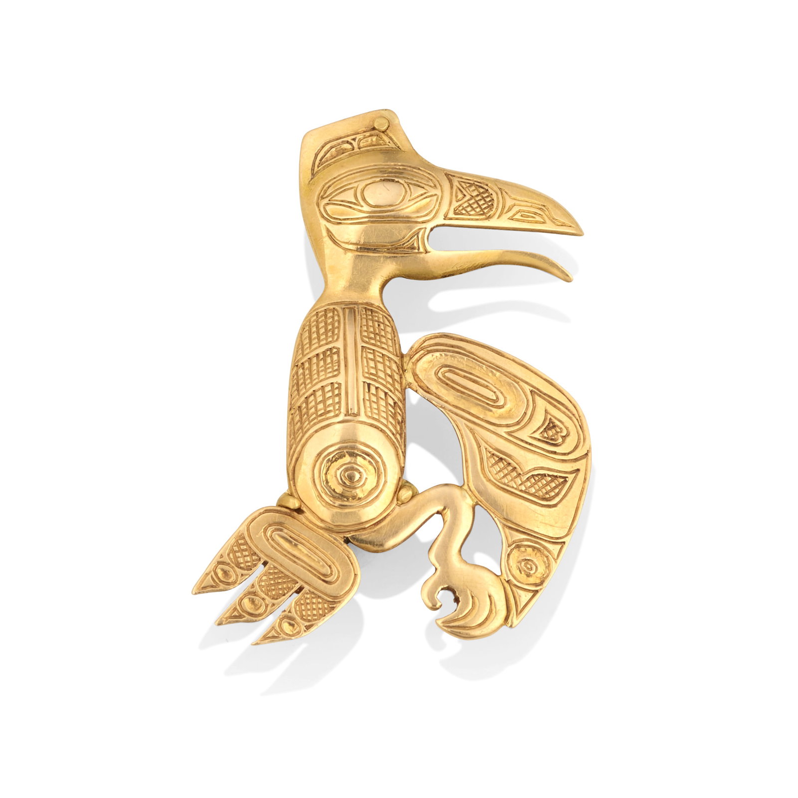 A Bill Reid gold raven-motif pin: Bill Reid (Iljuwas), O.B.C., R.C.A. Haida, (1920-1998), an 18k gold pin designed in the form of a raven with chased formline decoration, signed verso: Haida Art, with later-added mark: GP, unmarked fo