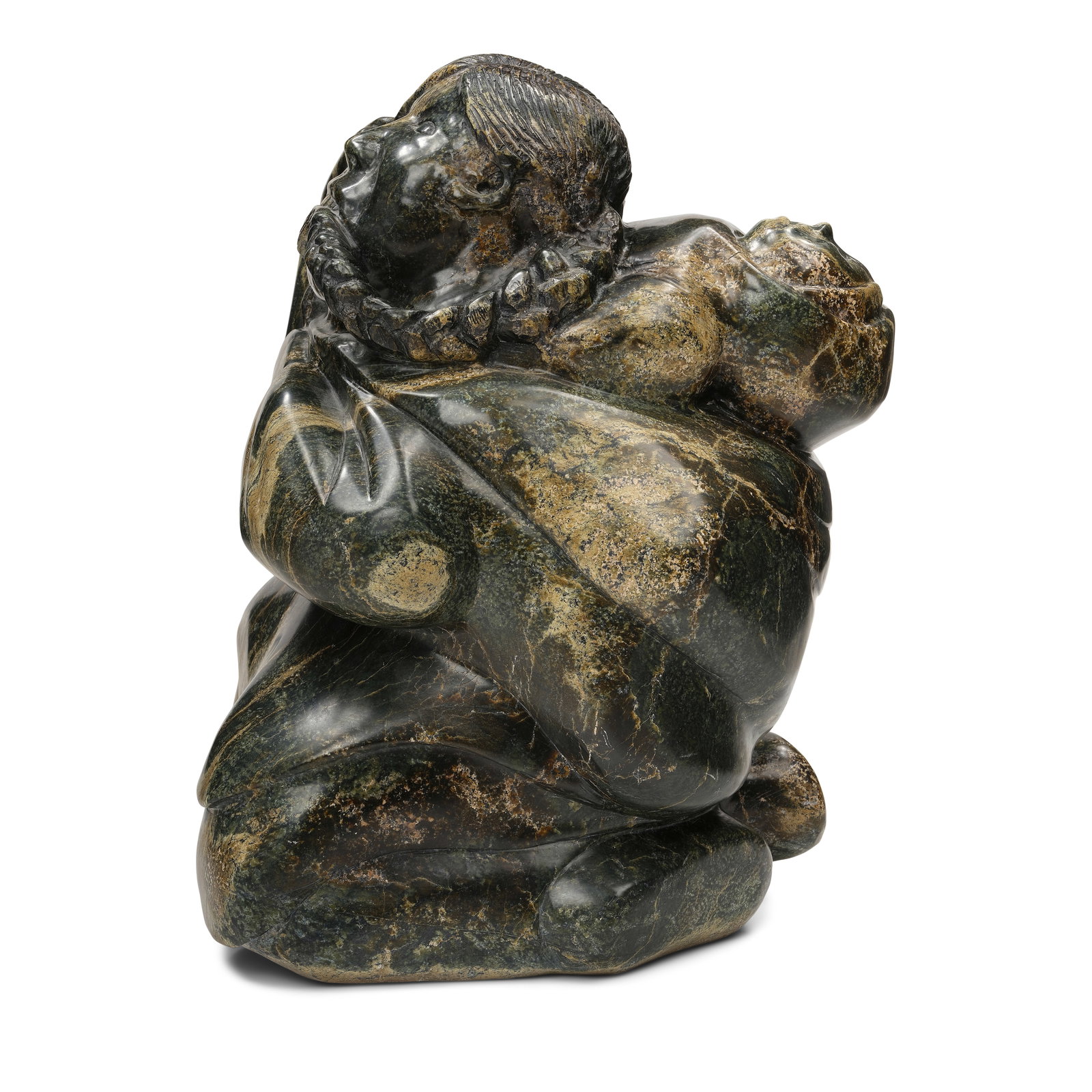 An Inuit stone sculpture: An Inuit stone sculpture Depicting a mother braiding her hair, her child held in her amauti, apparently unsigned. height 20 3/4in, width 14in Footnotes: Provenance Property from the John & Joyce Price