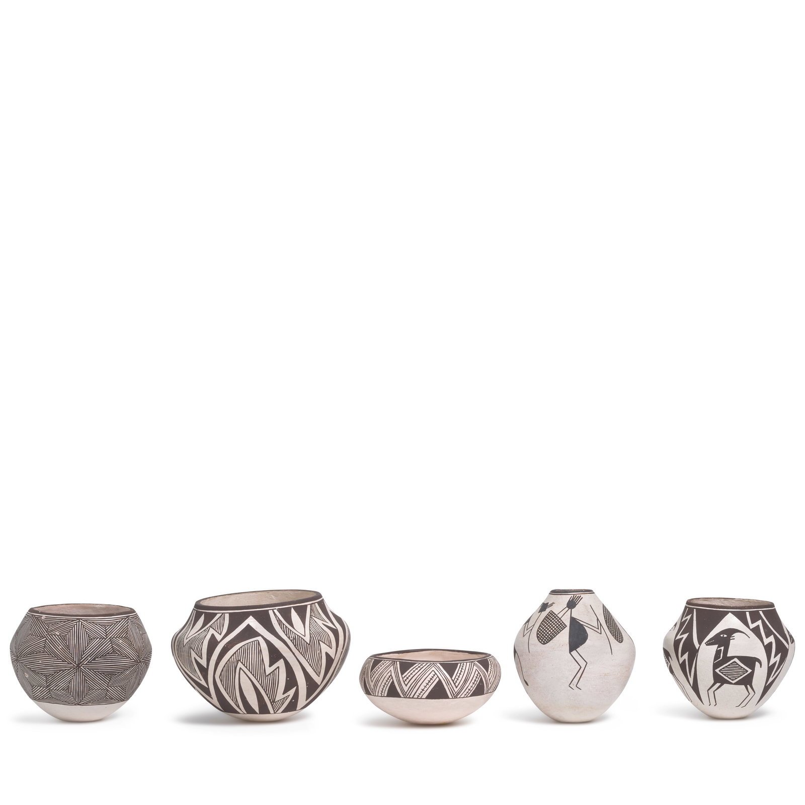 Five Lucy Lewis black-on-white pottery jars: Lucy M. Lewis Acoma Pueblo, (1890-1992), five black-on-white pottery jars, one with Kokopelli figures, one with ancestral-style deer, the others with geometric designs. largest (with serrated designs)
