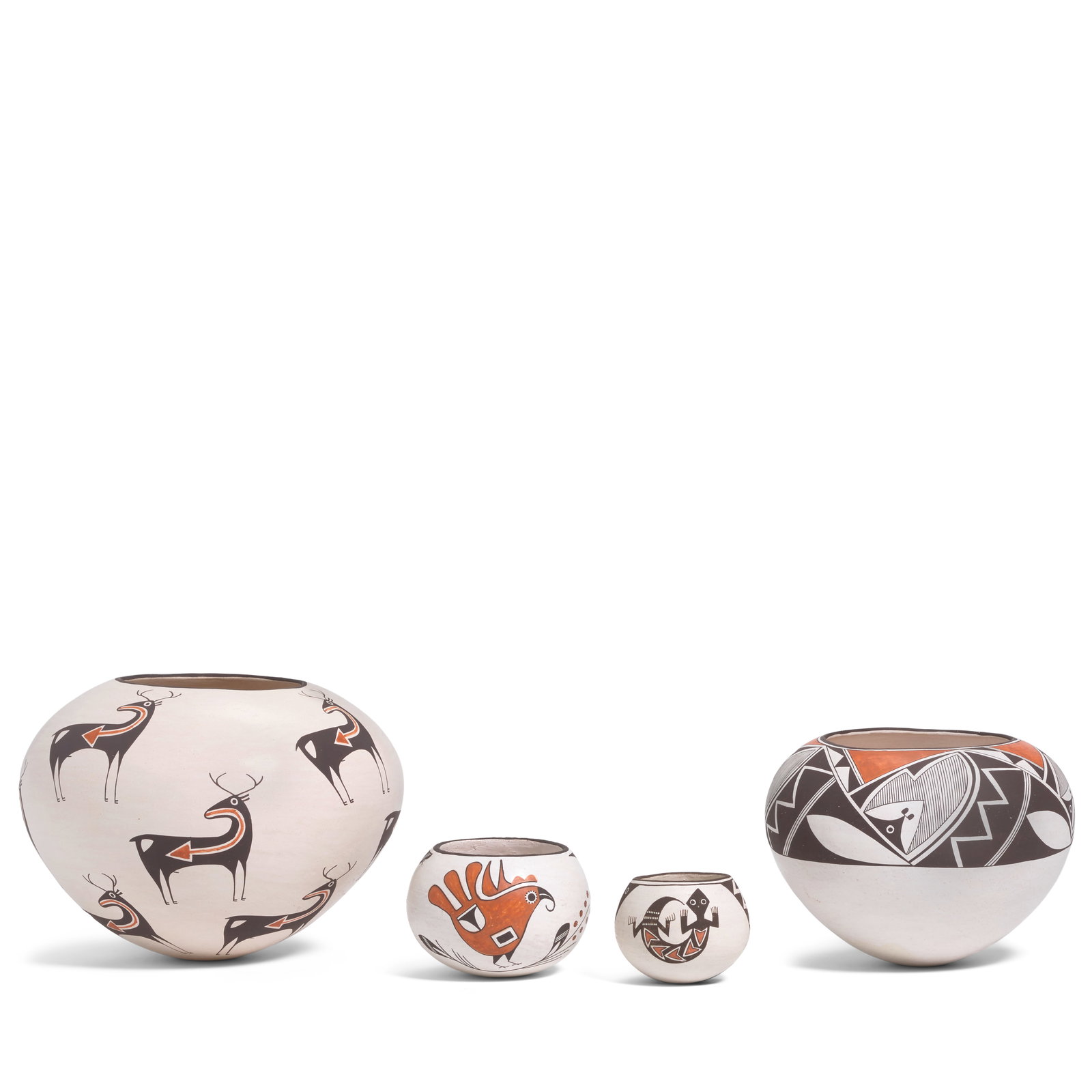 Four Emma Lewis polychrome pottery jars: Emma Lewis Acoma Pueblo, (1931-2013), four polychrome pottery jars, the largest with heartline deer, the second largest with a wide geometric band, the third in a parrot motif, and the fourth with liz