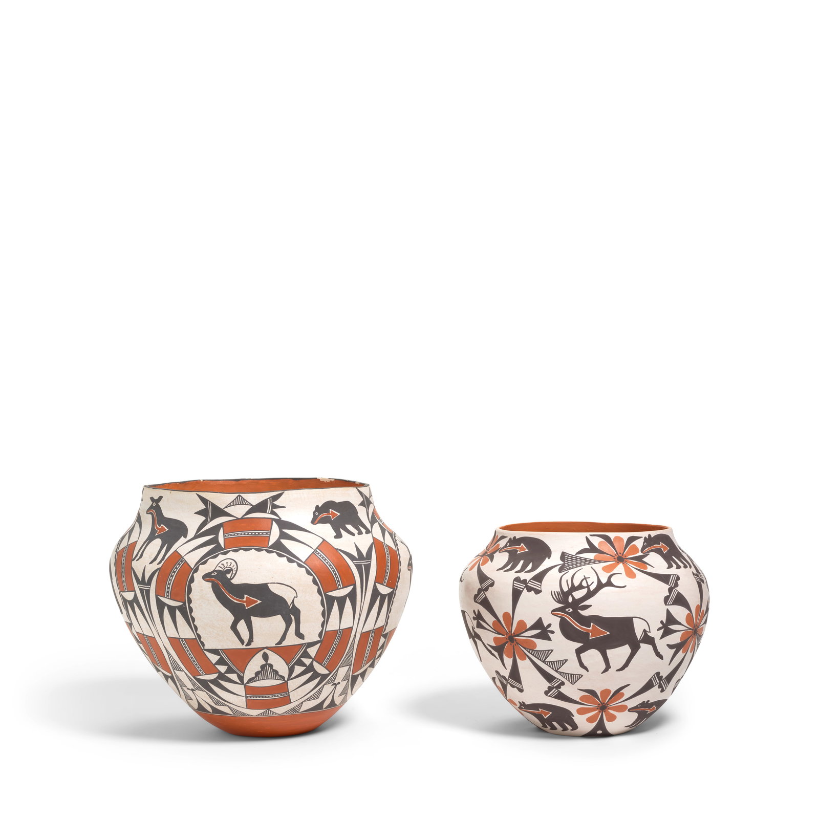 Two Mildred Antonio polychrome pottery jars: Mildred Antonio Acoma Pueblo, (b. 1937), two polychrome pottery jars, the larger with heartline animals within and between geometric arches, the smaller with heartline animals and flowers, each signed