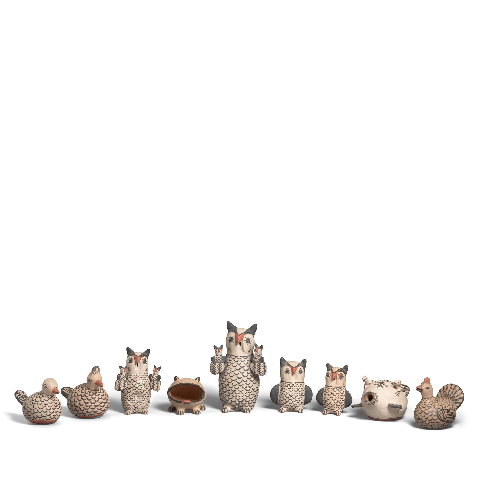 Nine Seferina Ortiz pottery objects: Seferina Ortiz Cochiti Pueblo, (1931-2007), nine animal-motif pottery objects, including four owls (two carrying a pair of babies), an open-mouthed frog, a canteen with applied lizards, a rooster, and