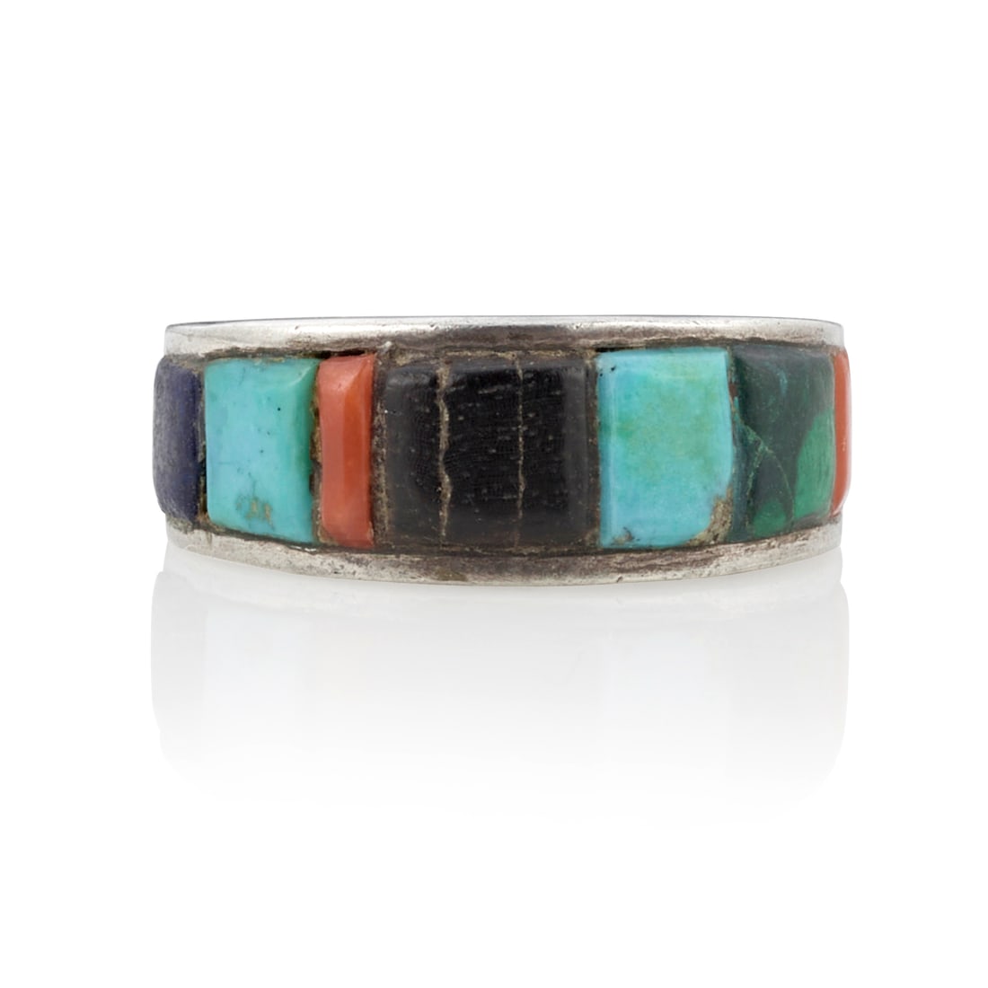 A Charles Loloma silver ring with mosaic inlay: Charles Loloma Hopi, (1921-1991), a silver ring with inlay set about the entirety of the tapered shank, including turquoise, coral, wood, lapis lazuli and malachite, engraved 'loloma' in cursive scrip