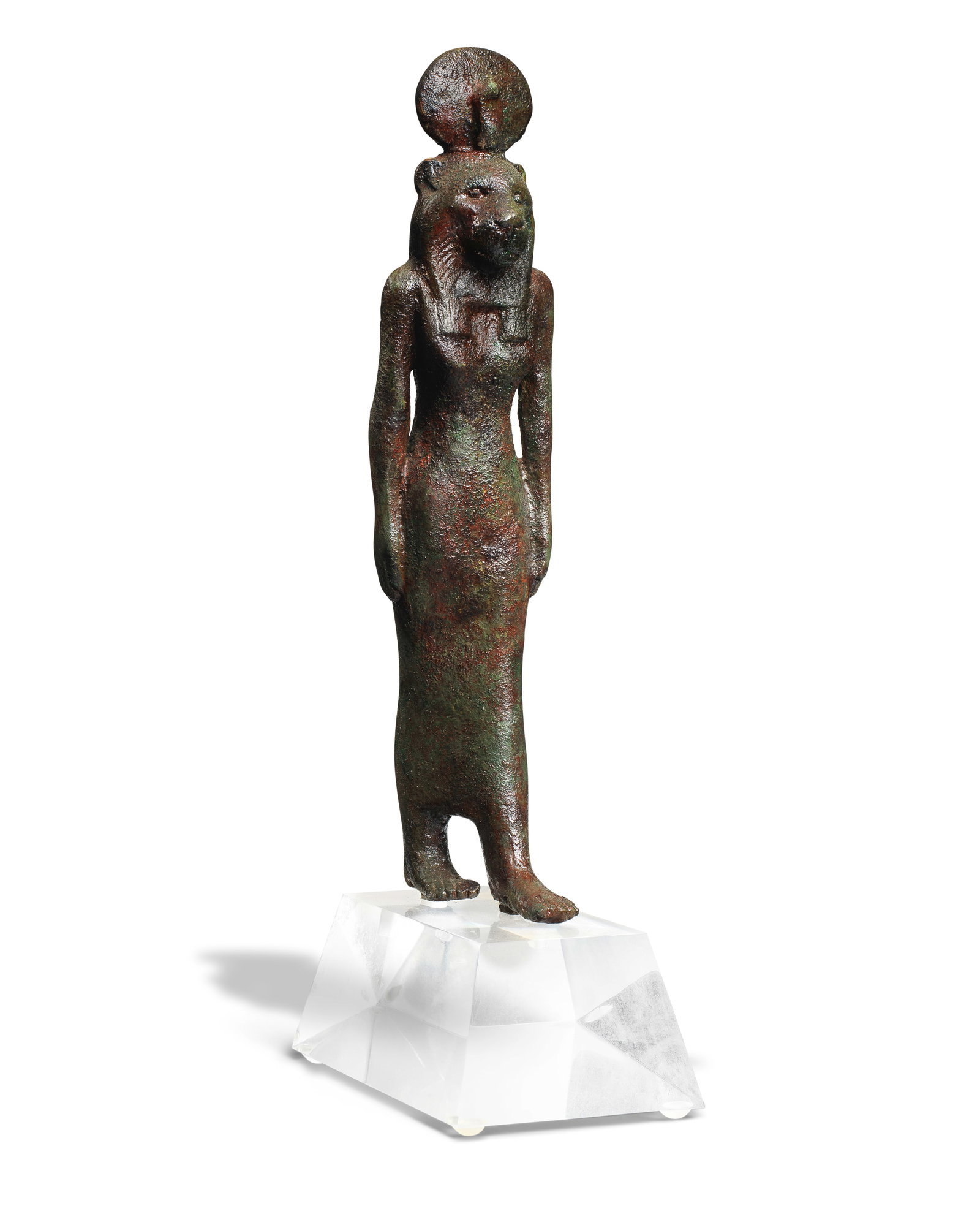 An Egyptian bronze striding Wadjet: An Egyptian bronze striding Wadjet Late Period, circa 664-332 B.C. 25cm high Footnotes: Provenance Reputedly discovered in 1886 during Sir W.M. Flinders Petrie's (1853-1942) excavations at Tell Nebes