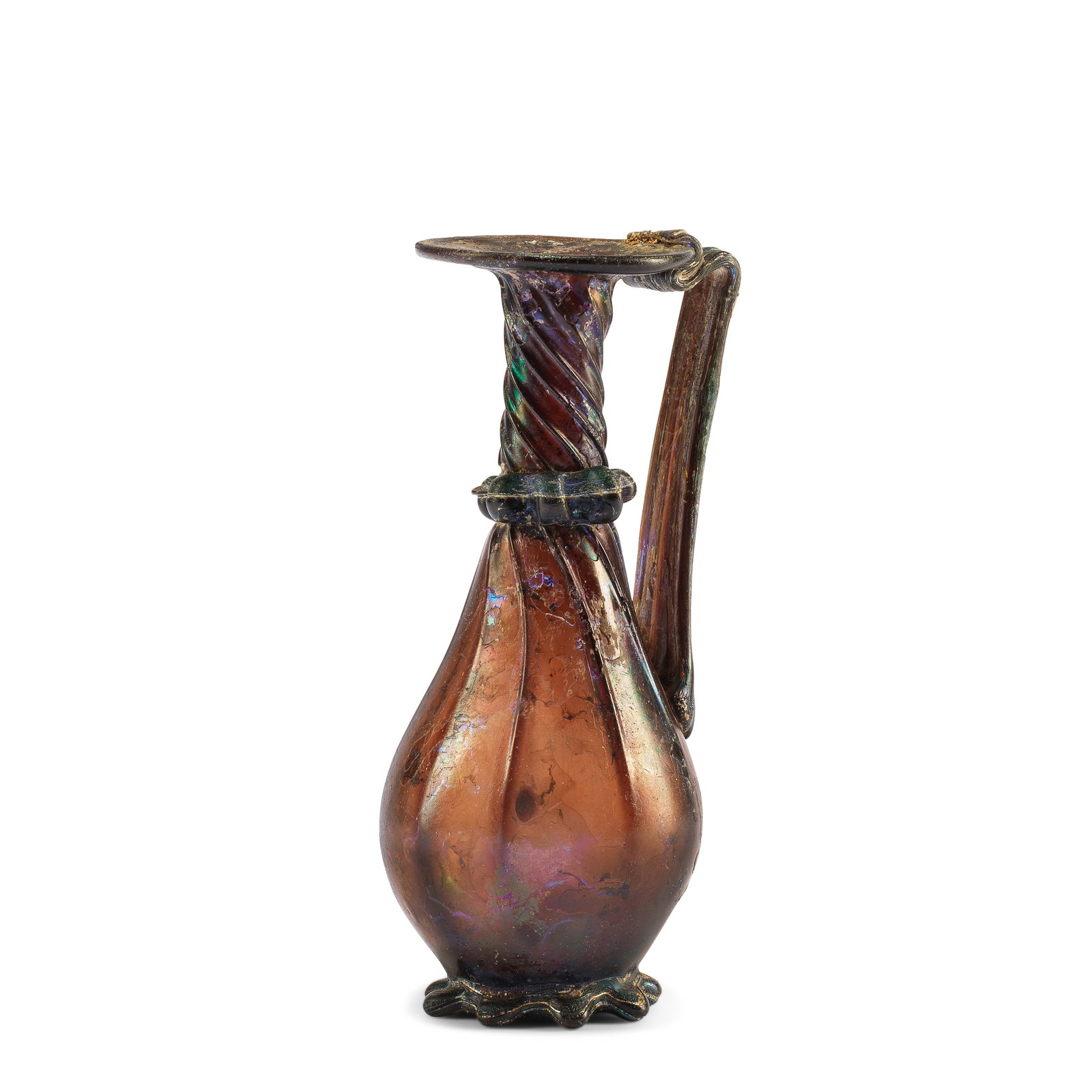 A Roman aubergine glass jug: A Roman aubergine glass jug Circa late 3rd-4th Century A.D. 15cm high Footnotes: Provenance Dr. Jutaro Kawabe collection, Nagoya, Japan, formed during 1960s-1980s. with Hoshigaoka Gallery until lat