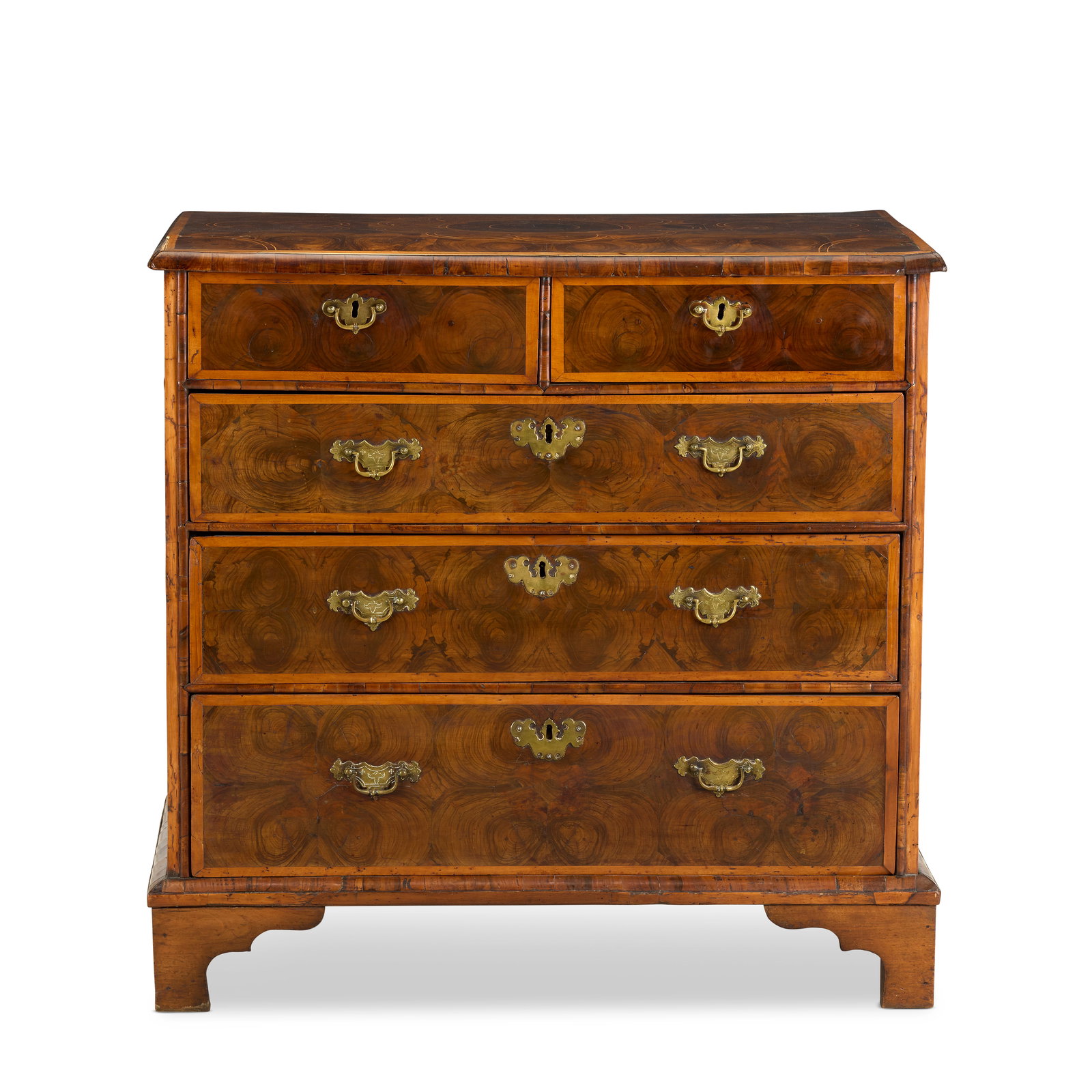 A William and Mary oyster veneered, sycamore banded and boxwood strung chestLate 17th / early 18...: A William and Mary oyster veneered, sycamore banded and boxwood strung chest Late 17th / early 18th century The top inlaid with radiating oyster veneers above two short and three long drawers, on late