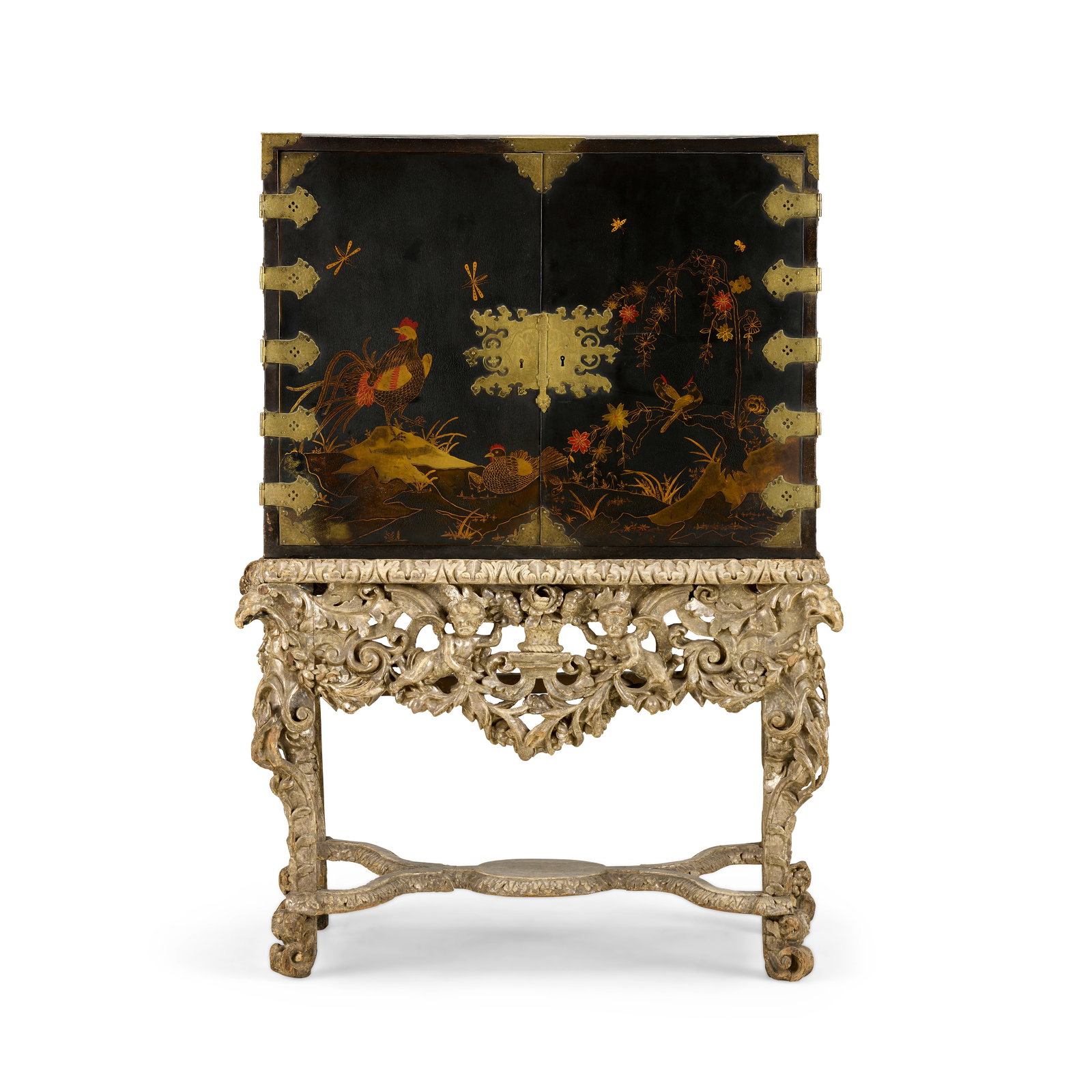 A black and gilt Japanned and lacquer cabinet on stand18th century and later: A black and gilt Japanned and lacquer cabinet on stand 18th century and later The later decorated panelled doors enclosing ten drawers decorated with birds within landscapes, on a profusely carved and