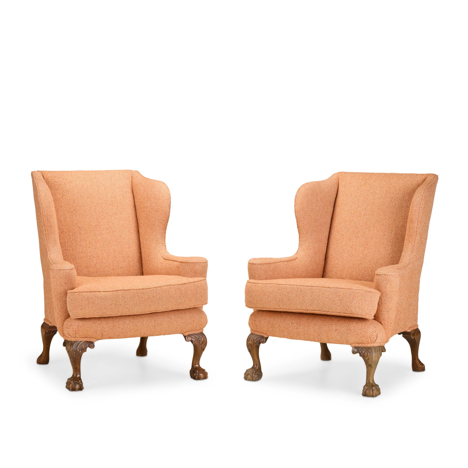 A pair of George II style walnut wingback armchairsEarly 20th century (2): A pair of George II style walnut wingback armchairs Early 20th century On front acanthus leaf carved cabriole legs, on ball and claw feet, recently upholstered in orange chevron needlework, 86cm wide