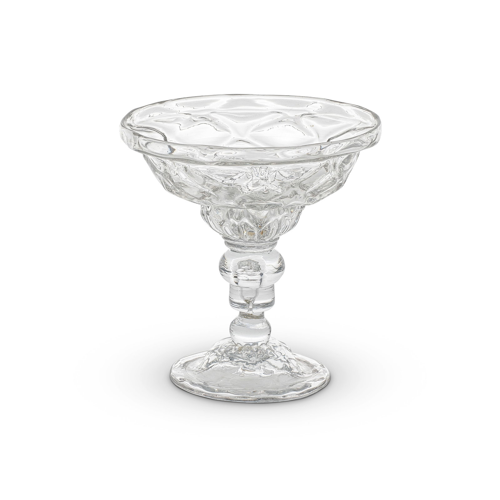 An acorn-knopped sweetmeat or champagne glass, circa 1730-40: An acorn-knopped sweetmeat or champagne glass, circa 1730-40 The broad double-ogee bowl moulded with 'nipt diamond waies' and basal gadroons, set on a double collar above a teared acorn knop and basal