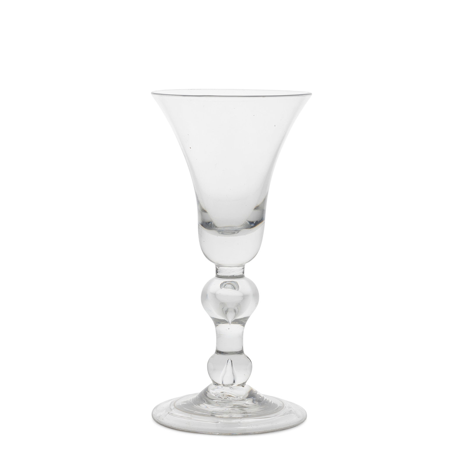 A very large heavy baluster goblet, circa 1715: A very large heavy baluster goblet, circa 1715 The generous bell bowl with a heavy solid base, the stem with a wide teared inverted baluster above a teared basal knop, over a folded conical foot, 27.3