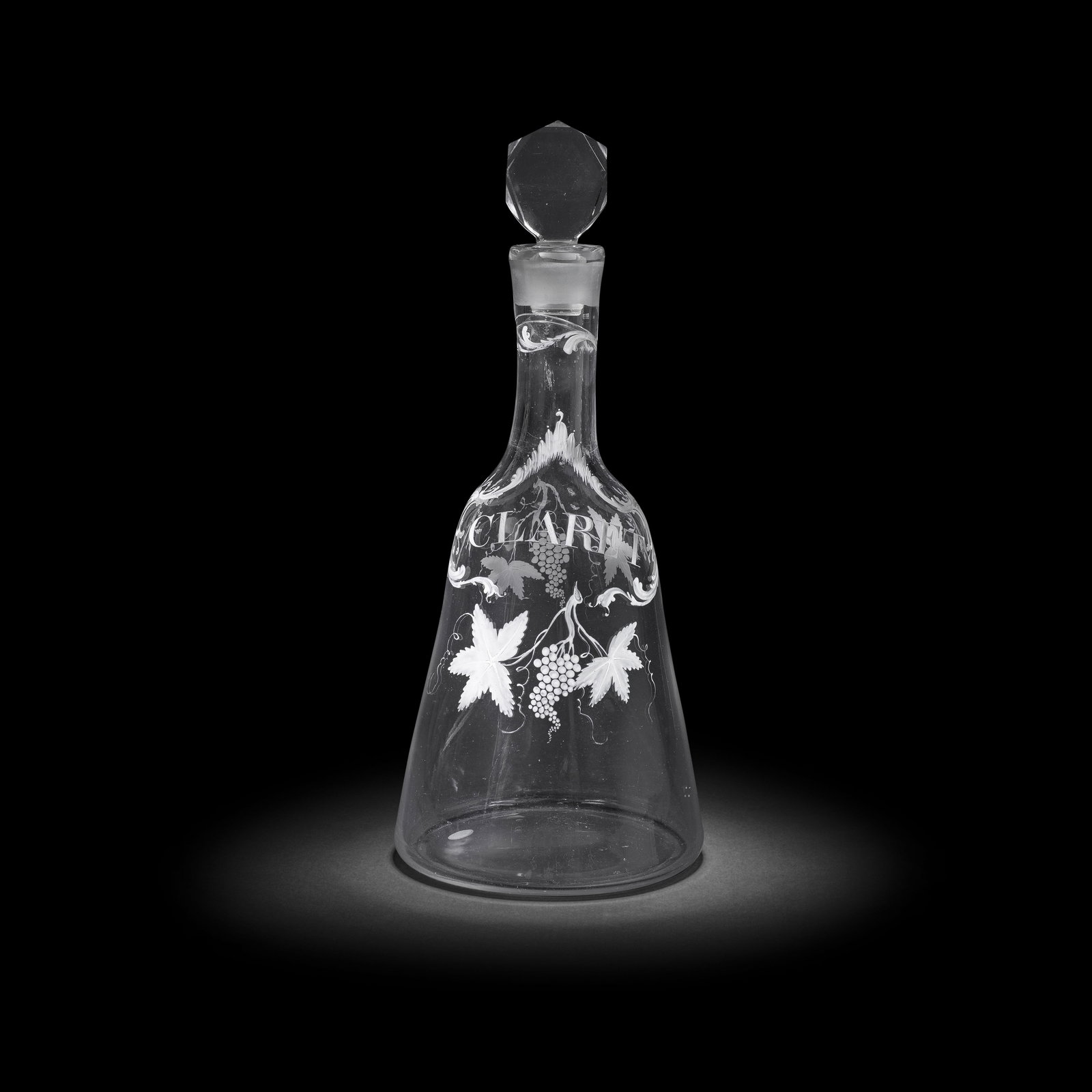 A remarkable Beilby enamelled magnum Claret decanter and stopper, circa 1765: A remarkable Beilby enamelled magnum Claret decanter and stopper, circa 1765 Of generous 'sugarloaf' form, finely decorated in opaque white with a scrollwork pseudo wine label cartouche inscribed 'CLA