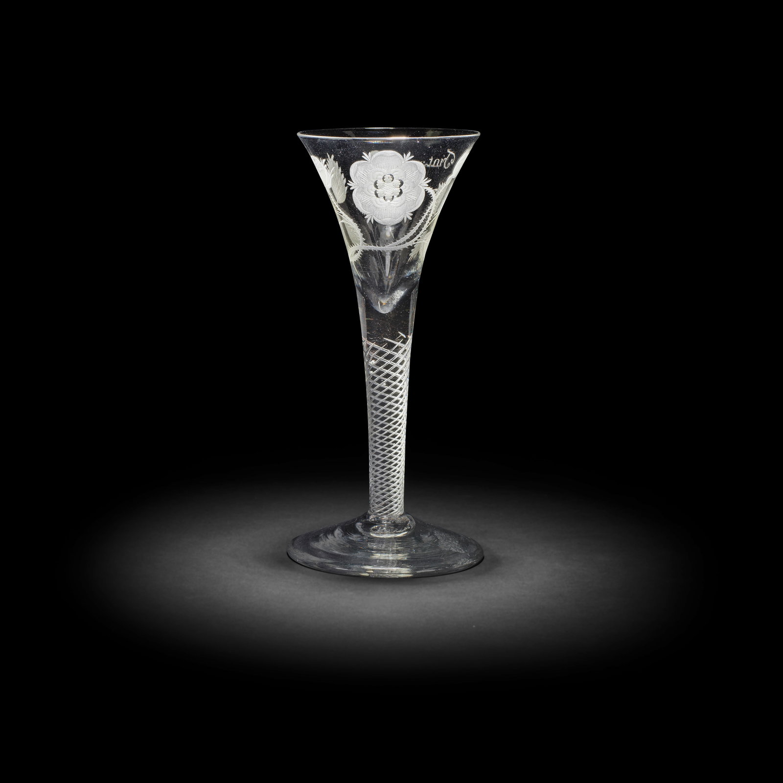 A Jacobite engraved airtwist wine glass, circa 1750: A Jacobite engraved airtwist wine glass, circa 1750 The generous drawn trumpet bowl with a six-petalled rose on a thorny stem with two buds, one closed and one open, the reverse with a large oak leaf