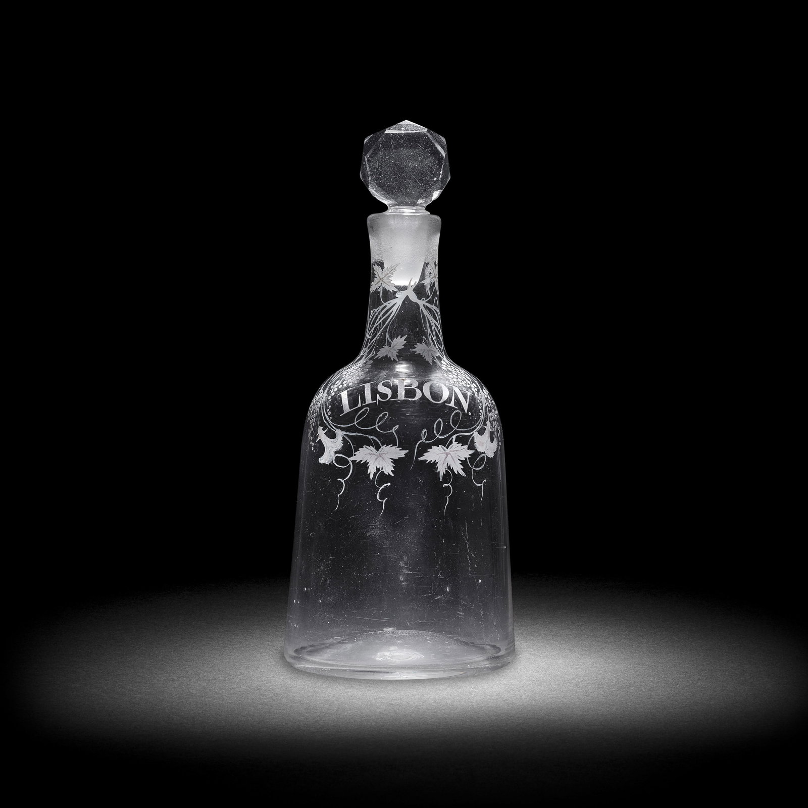 A very rare Beilby enamelled Lisbon decanter and a stopper, circa 1765: A very rare Beilby enamelled Lisbon decanter and a stopper, circa 1765 Of so-called 'sugarloaf' form, finely painted to the neck and shoulder in opaque white with a pair of fruiting vine tendrils inte