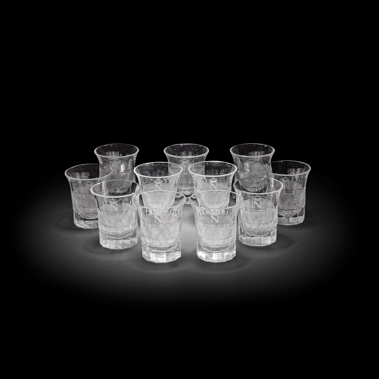 A remarkable set of twelve cut and engraved glass tumblers of Napoleonic interest, probably circ...: A remarkable set of twelve cut and engraved glass tumblers of Napoleonic interest, probably circa 1903 Attributed to J & L Lobmeyr, each of cylindrical form with a flared rim, cut with a wide central