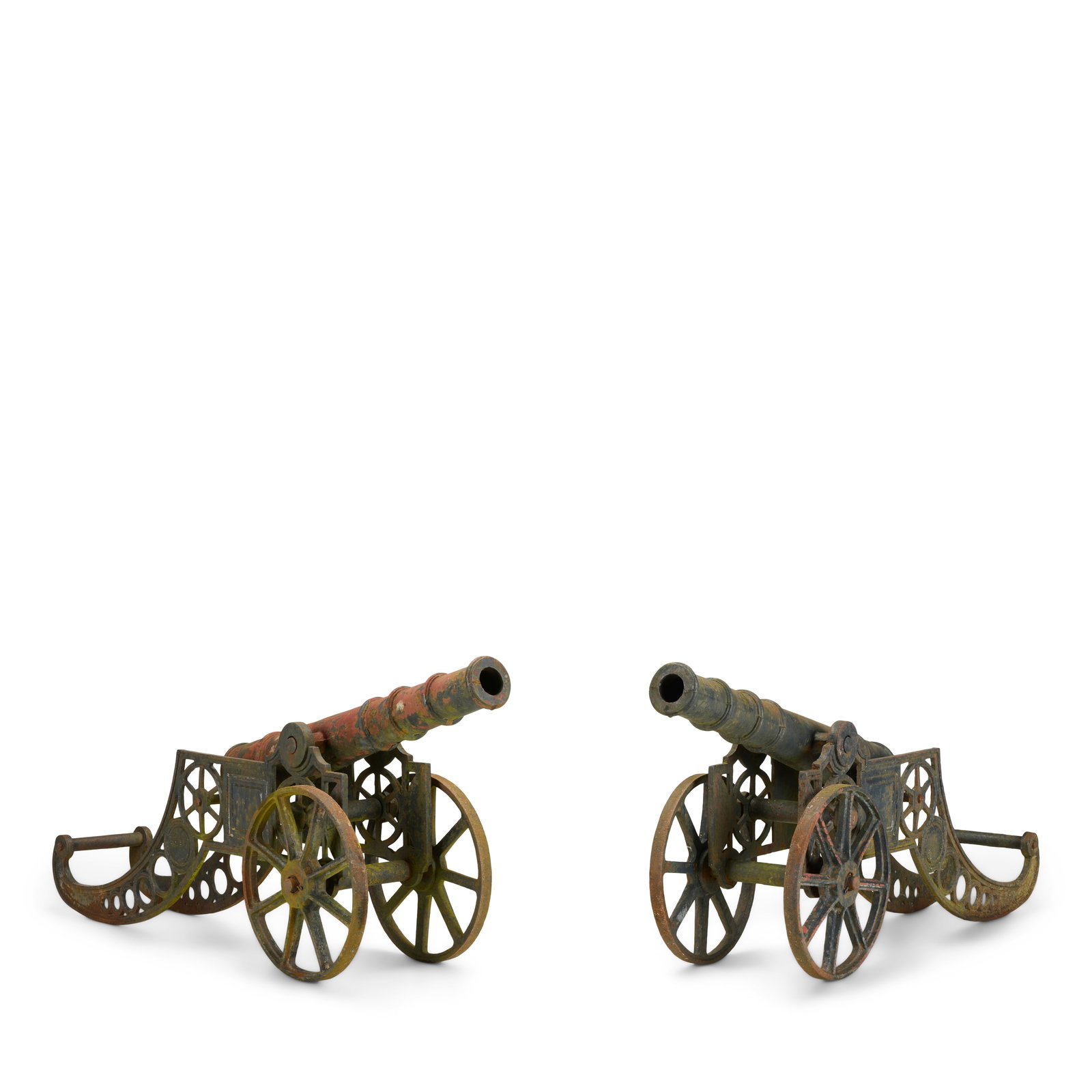 A pair of Victorian cast-iron garden cannons Late 19th century (2): A pair of Victorian cast-iron garden cannons Late 19th century The tapering banded barrels mounted on twin wheeled pierced scrolling gun carriages, each initialled R.M.I to one side, 37cm wide, 135cm