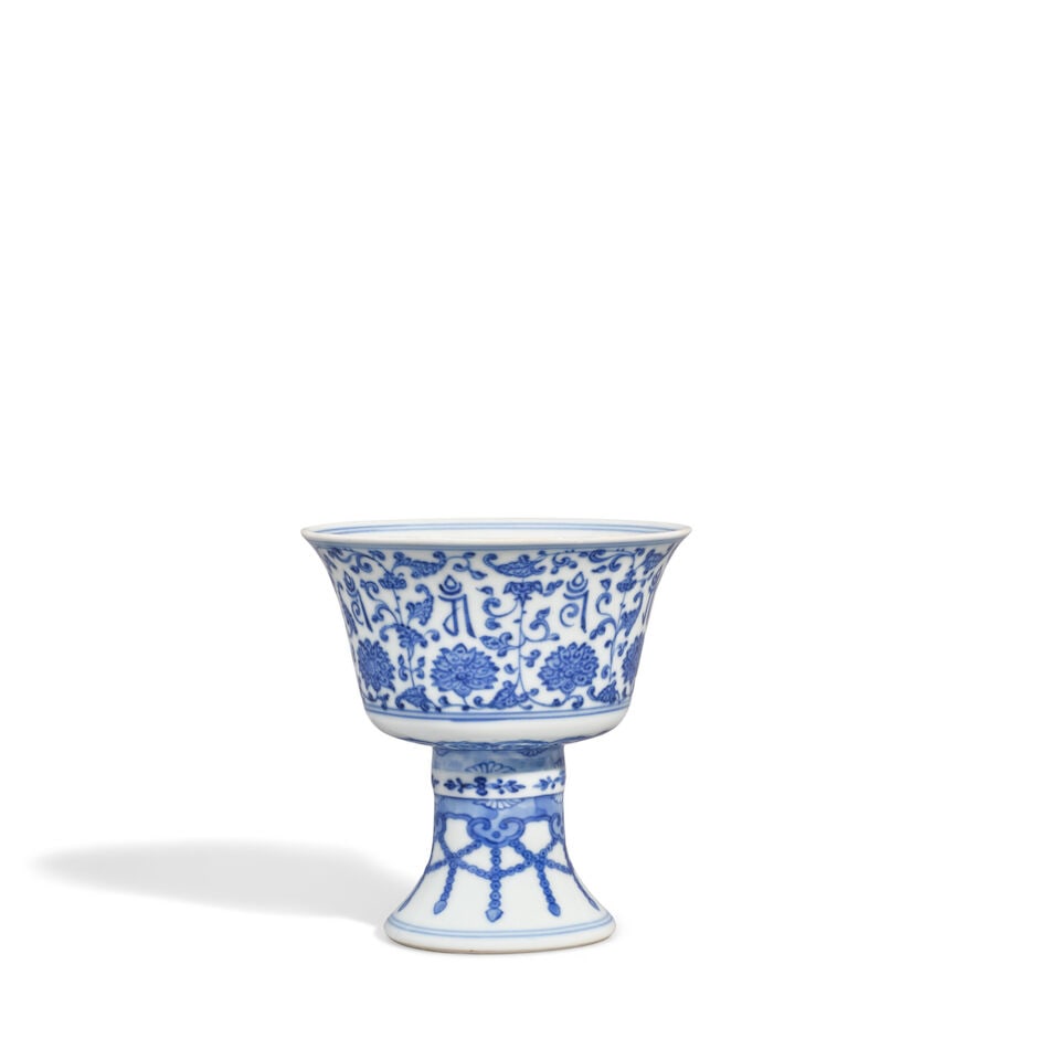 A BLUE AND WHITE 'LANÇA' STEMCUP Qianlong seal mark and of the period (box): A BLUE AND WHITE 'LANÇA' STEMCUP Qianlong seal mark and of the period The interior foot with a six-character Qianlong seal mark in underglaze-blue. 7 3/4in (19.7cm) high