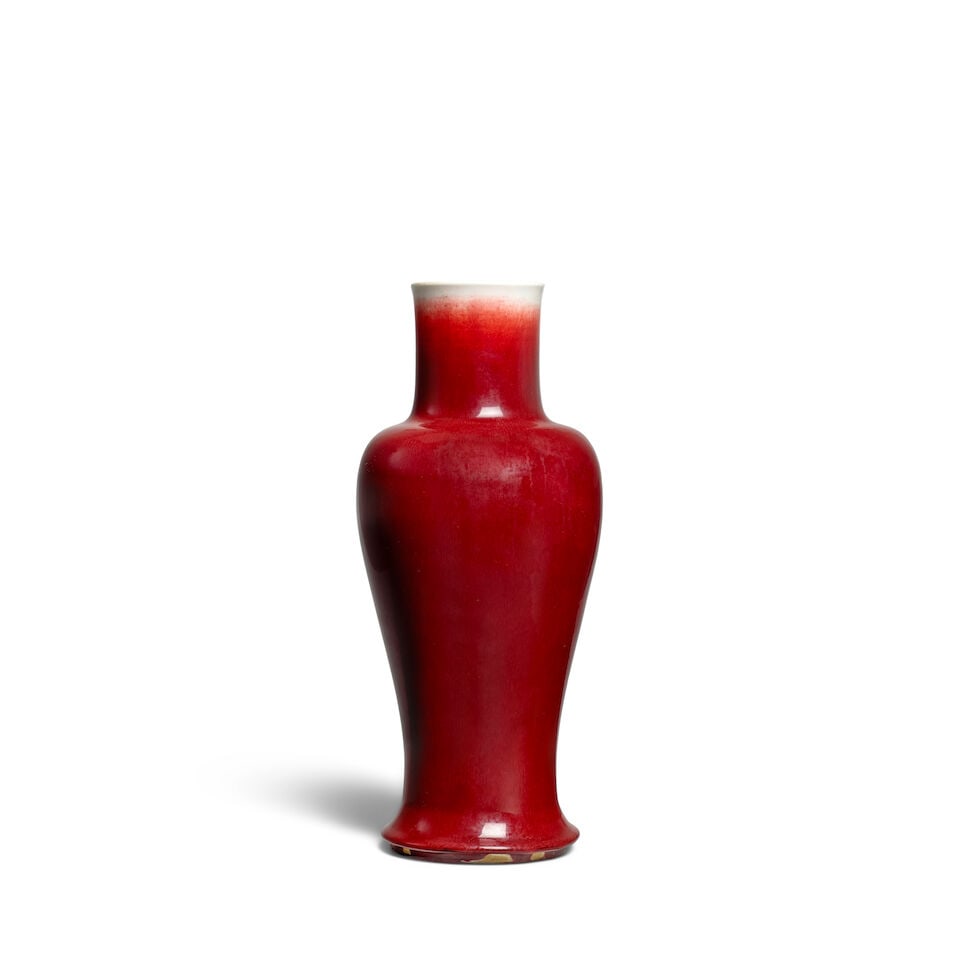 A RED-GLAZED VASE 18th/19th century: A RED-GLAZED VASE 18th/19th century 16 1/2in (42cm) high Footnotes: 十八/十九世紀 紅釉觀音尊 Provenance: Ralph M. Chait Galleries, New