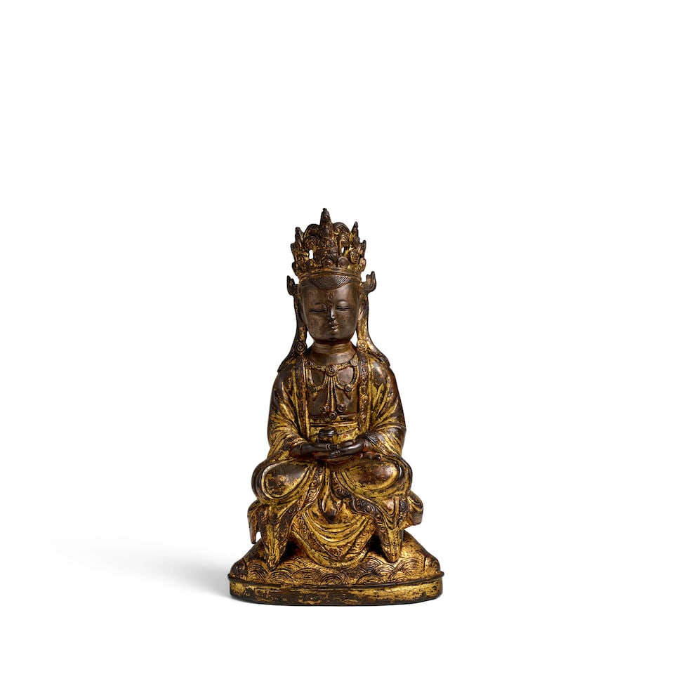 A GILT-BRONZE FIGURE OF SEATED BODHISATTVA Ming dynasty: A GILT-BRONZE FIGURE OF SEATED BODHISATTVA Ming dynasty 8 3/4in (22.2cm) high Footnotes: 明 鎏金銅觀音坐像 Provenance: Penglai Shanfang Collection, Tain